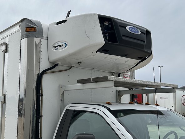 Some refrigeration units have the connection point inside the cab. However, for units with the connection point outside the cab, you will need to run the refrigeration unit harness outside.