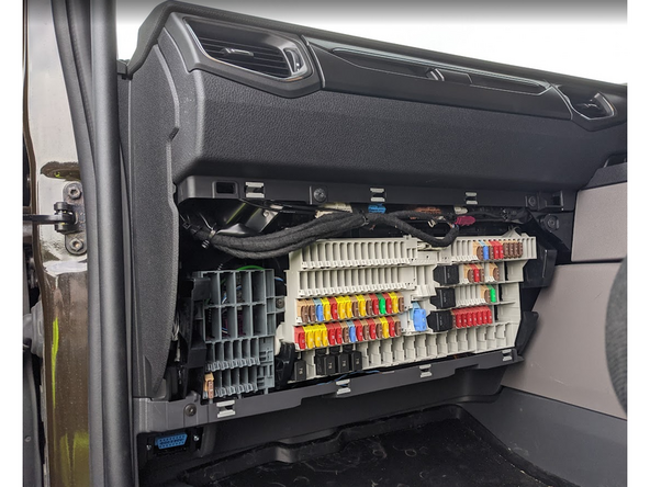 Use a panel removal tool to unclip and remove the front cover.