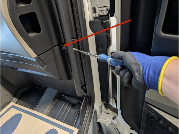 Remove the screw from the side panel as shown.