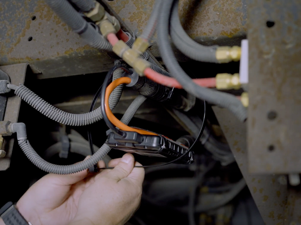 Find a suitable mounting location for the AssetTrac device.