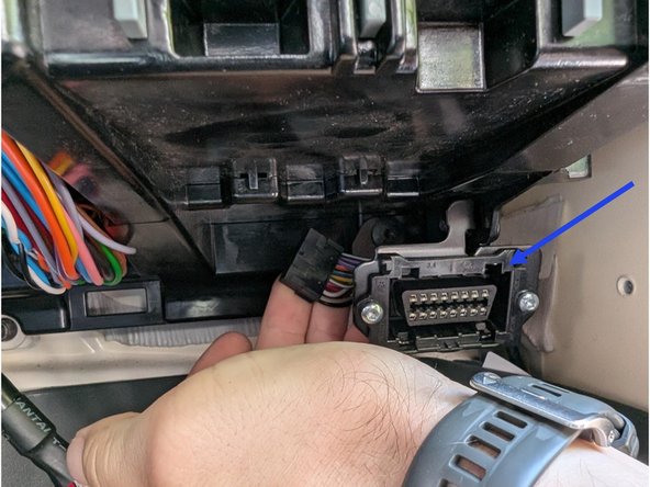 Clip the short section of the harness into place in the vehicle