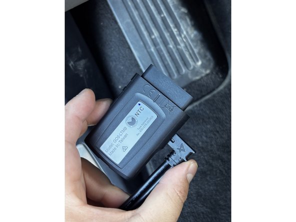 On the GO device, remove the IOX expansion port cover and plug in the IOX extension cable.