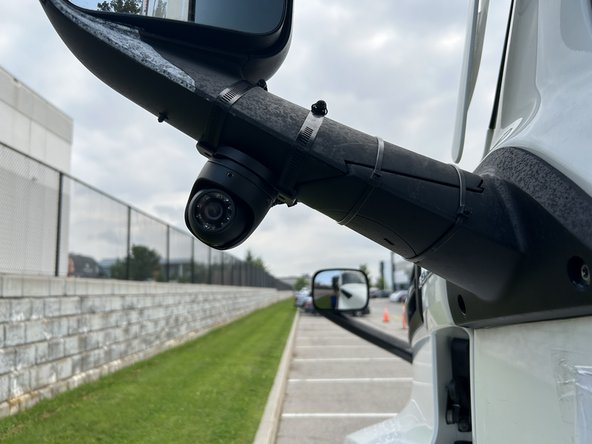 Apply the included adhesive backed silicone strip to the bracket contact surface to protect the mirror from damage.