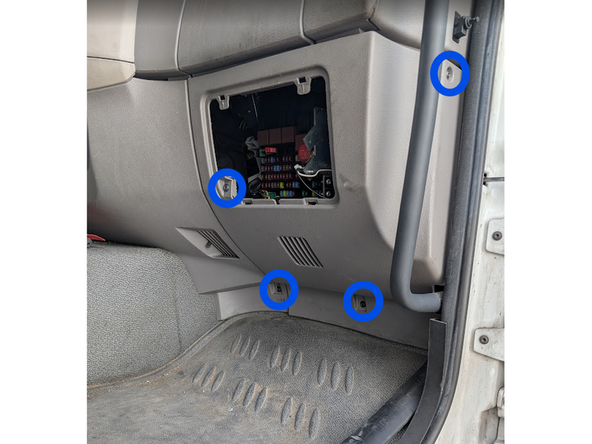 Remove the 4 x T20 torx screws from the middle panel as shown.
