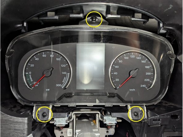 Remove the instrument cluster held by 3 screws as shown.