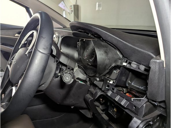 Next, unclip the instrument cluster cover and remove the whole assembly.
