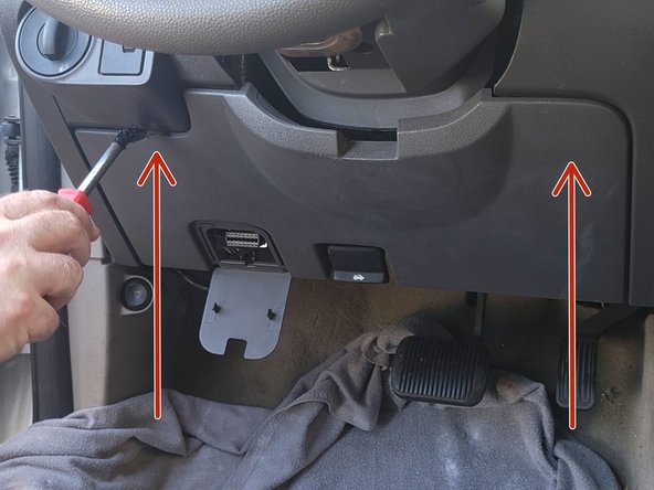 Using a panel removal tool, remove the knee bolster.