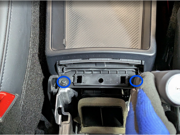 Remove the two additional screws as shown.