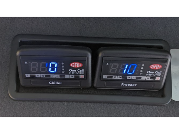 Find the controller located inside the vehicle cabin.