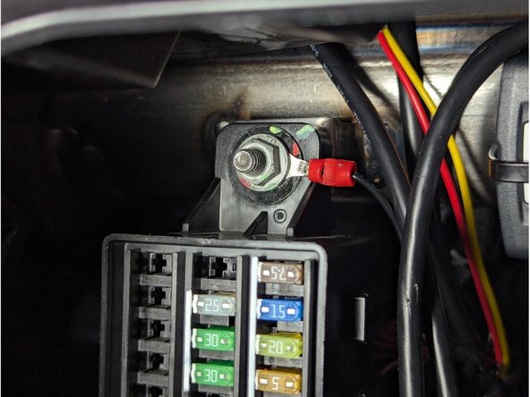 Route the white connector of the HRN-CW03K3-A harness from the top towards the fuse block. Attach the BLACK wire (GROUND) as shown.