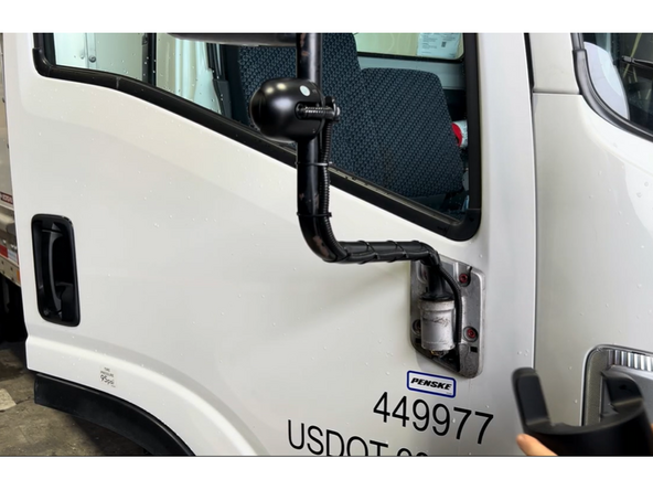 Secure the cable to the mirror arm at regular intervals using zip ties. Keep the cable snug against the arm to prevent wind vibration.