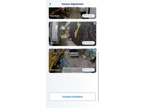 A portion of the rear of the vehicle (bumper or rear doors) at the top of the frame.