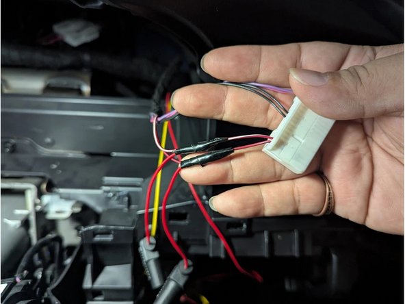 Strip a portion of the RED-WHITE wire (Pin 38) and connect the YELLOW wire (IGNITION). Solder for a secure connection. Insulate with electrical tape.
