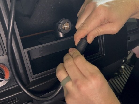 Connect the round connector from the harness to the monitor.