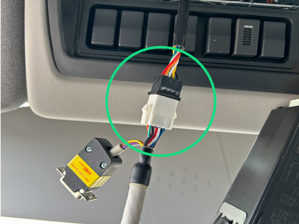 Unplug the in-cabin controller from its original vehicle connected harness.