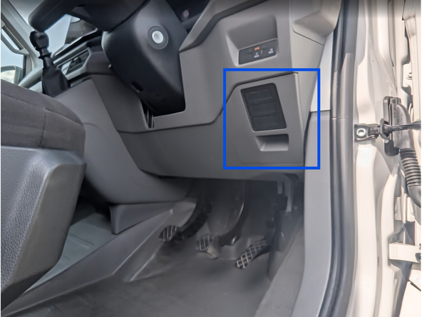 Unclip and remove the panel from the side of the dashboard.