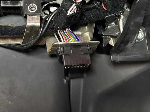 Install the prepared T-harness connector and mount it into the factory diagnostic port location.