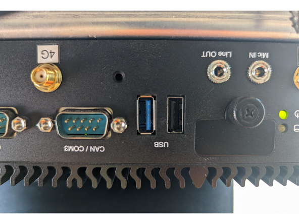 Plug the Peak USB adapter into the side of the TCU blue colored port into the Windows computer located under the cover of the center compartment.