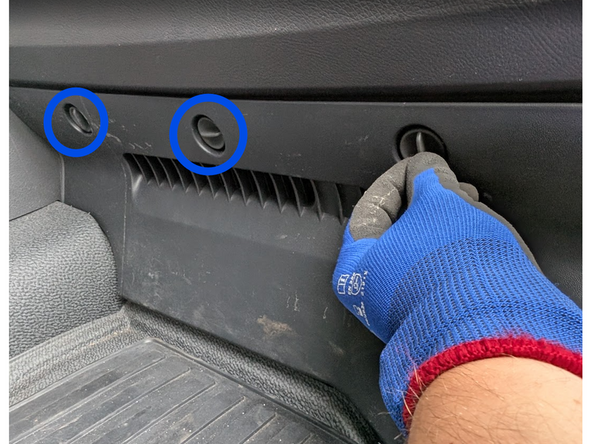 Unlock the quick-release fasteners on the plastic trim panels