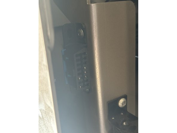 Locate and remove the OBD2 port from under the dash just to the left of the steering wheel.