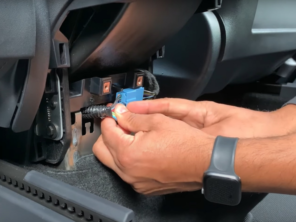 Unplug the Tesla connector and then plug in the HRN-CT20T11 Geotab harness.