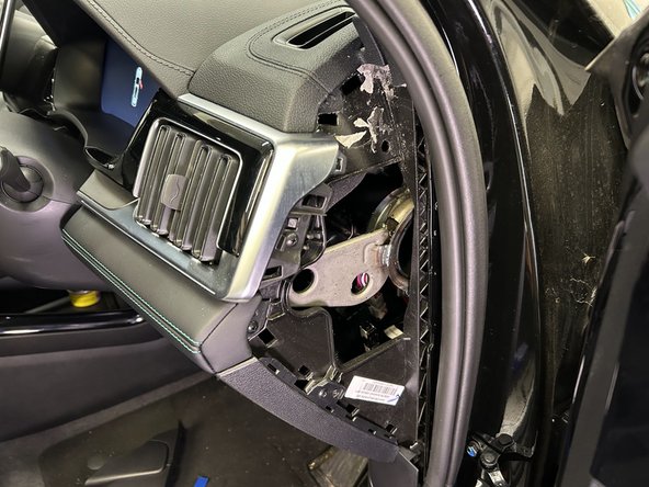 Pull the middle panel on the A-pillar using a panel removal tool.