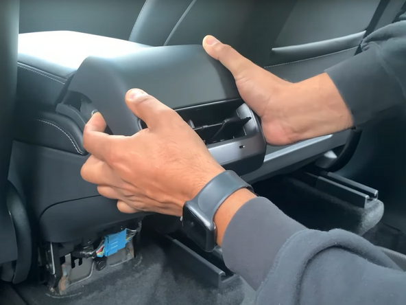 Carefully pull the air vent panel outwards to release the clip and remove the panel.