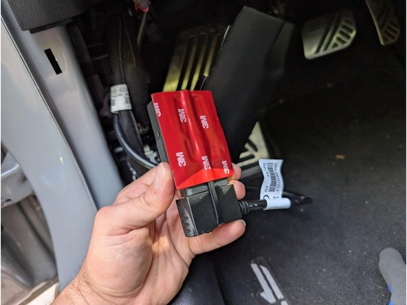 Apply a double-sided tape to the rear of the GO device, making sure its the side opposite from the serial number.
