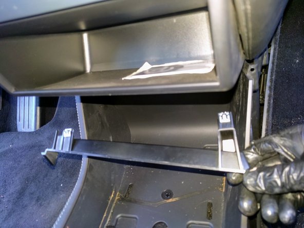 Carefully unclip and remove the small bracket.