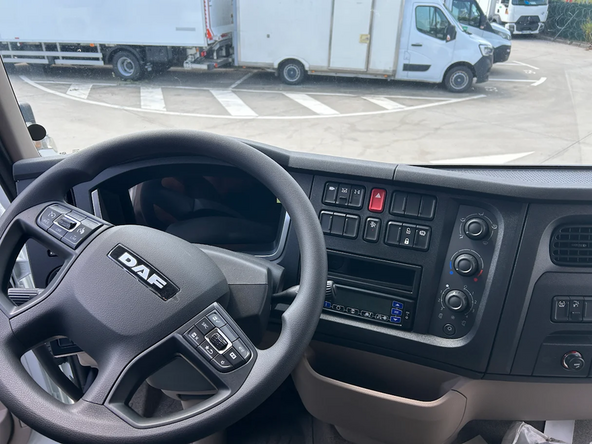 Find the in-cab controller located in the vehicle cabin and remove it from its mechanical support, if needed.