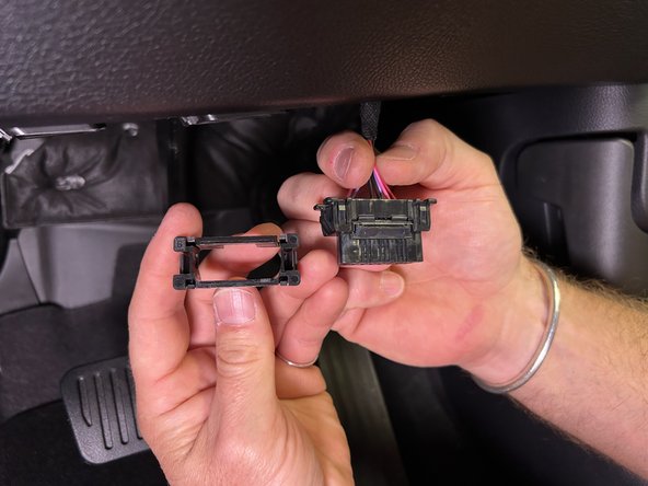 Pull the middle panel on the A-pillar using a panel removal tool.