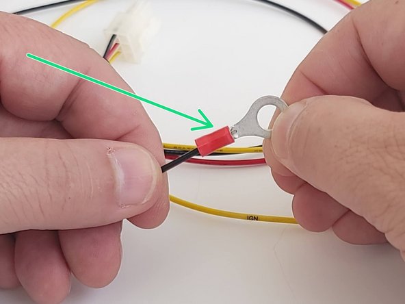 Using your wire crimpers, crimp the ring terminal on to the Black wire.