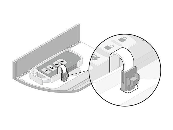 Place the key fob in the key bed.