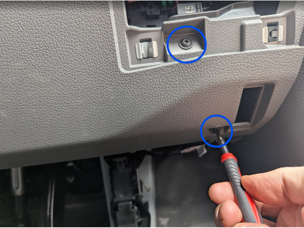 Use a Torx-driver to remove the two screws.