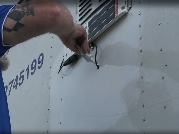 Pass the entire length of the harness through the trailer wall and seal any holes using a silicone sealant.