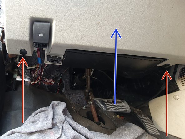 Remove these (2) plastic rivet fasteners.