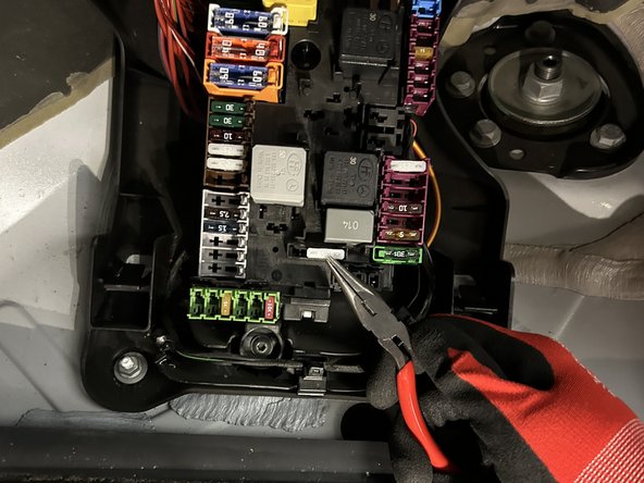 Locate and test the fuse for Starter Interrupt using a Digital Multimeter.