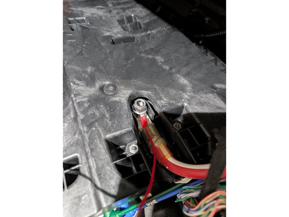 Directly connect the red wire's ring terminal to the low voltage battery to establish a continuous power source.