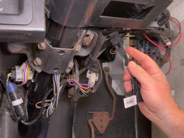 Route the HRN-CL06T4U Harness over the steering column