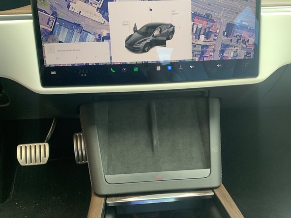 Use a trim panel removal tool to release the clips as shown in the image.