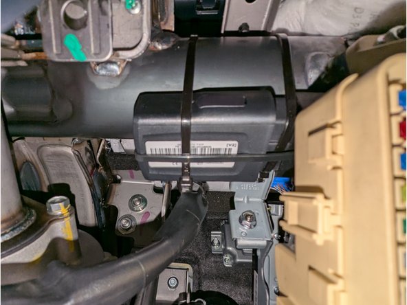 Secure the GO9 device to a suitable location using cable-ties as shown secured to a round metal bar underneath the dashboard where the fuse box is connected.