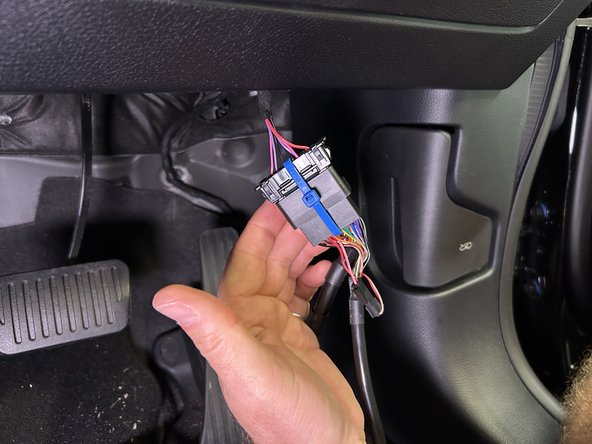 Plug the female connector from the T-harness into the OEM OBDII connector.
