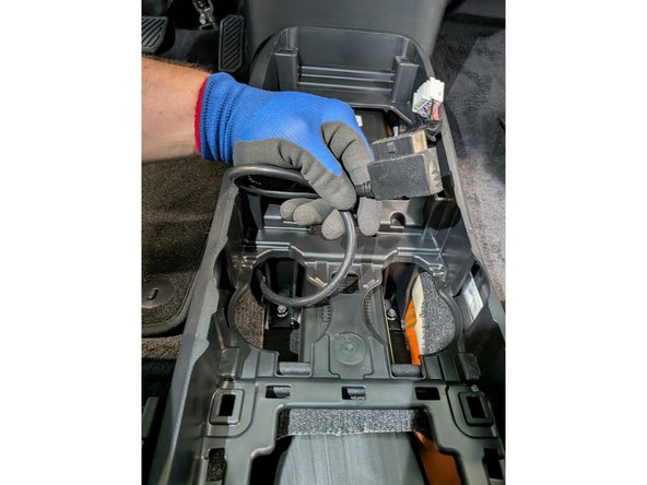 Plug the Geotab device into the harness and secure it with a cable tie as shown.
