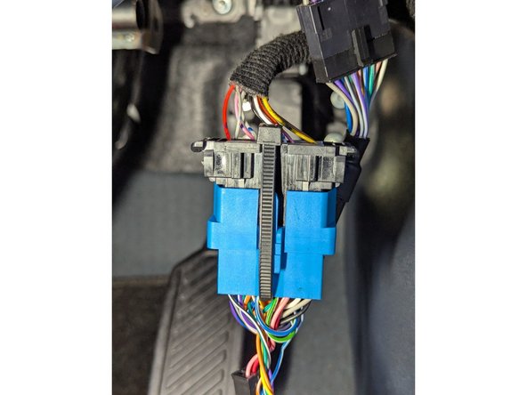 Connect the female end of the HRN-GS16K2-HD harness to the factory diagnostics port and secure it with a cable tie as shown.
