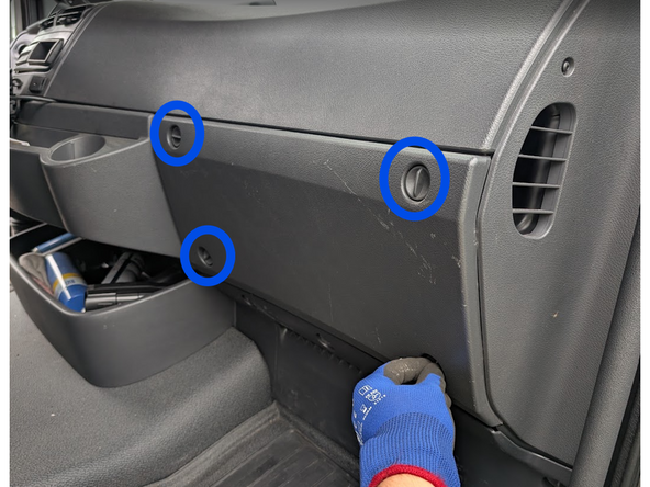 Unlock the quick-release fasteners on the plastic trim panels