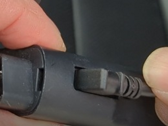 On the GO device, remove the IOX expansion port cover and plug in the IOX extension cable.