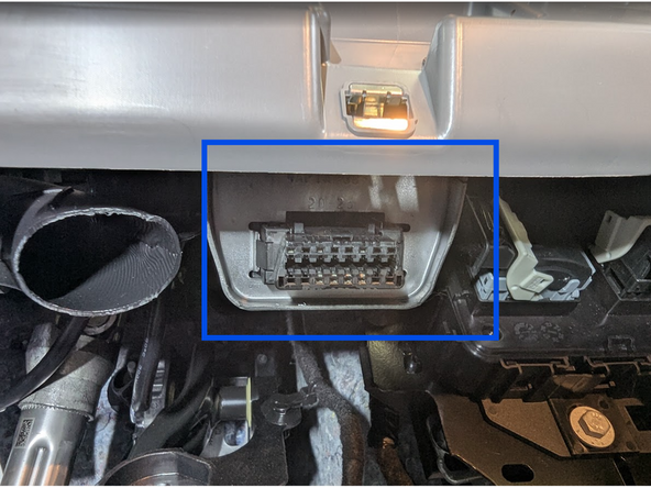 Locate the OBD-Port below the steering wheel in the driver’s footwell.