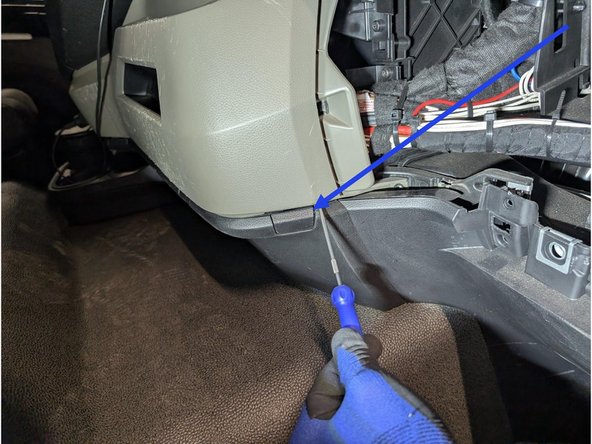 Unclip the small access lid and remove the screw located behind it.