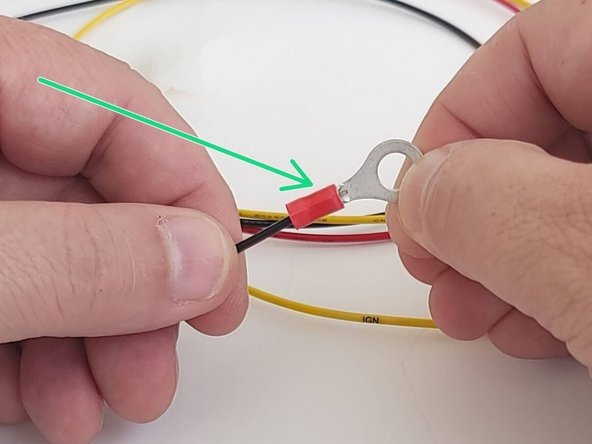 Using your wire crimpers, crimp the ring terminal on to the Black wire.