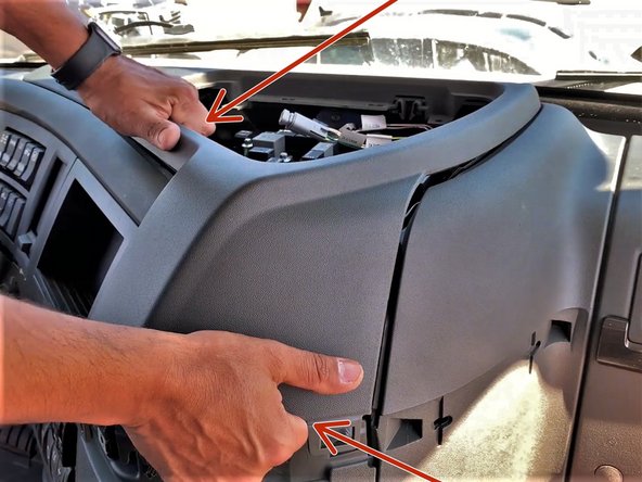 Pull up on the panel to release.